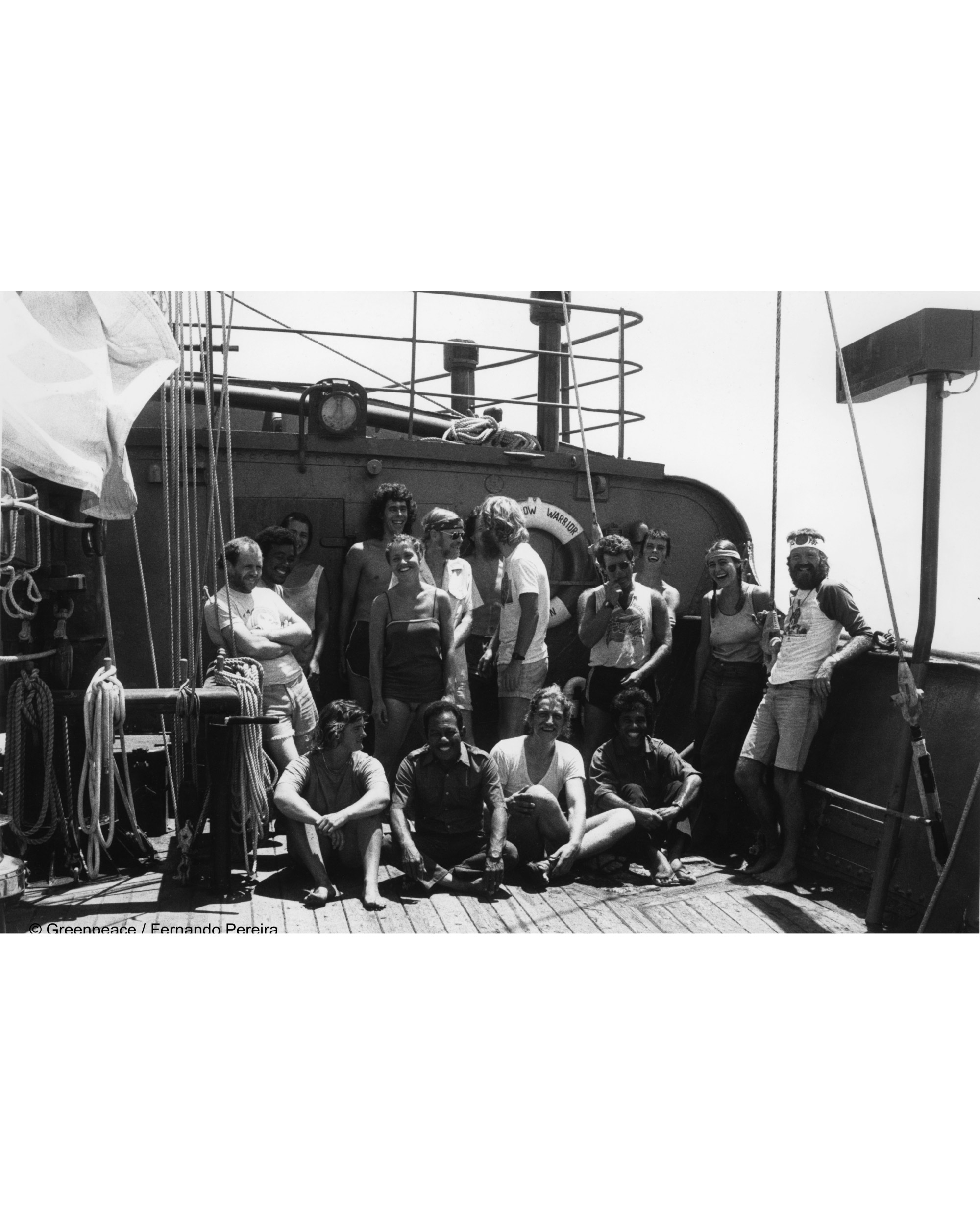 Peter (standing, 4th from right) with his Rainbow Warrior crew. Image courtesy of Greenpeace.